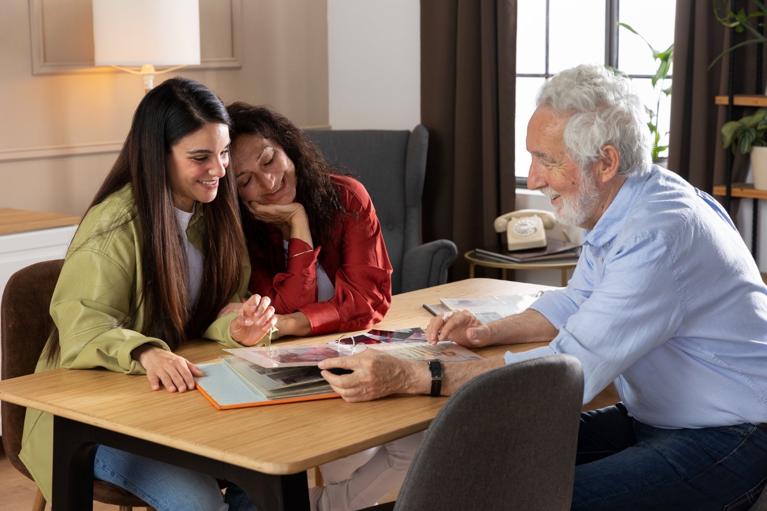 Family members discussing information together at a table.